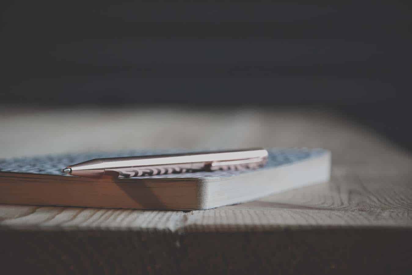 Pad and pen on a table.