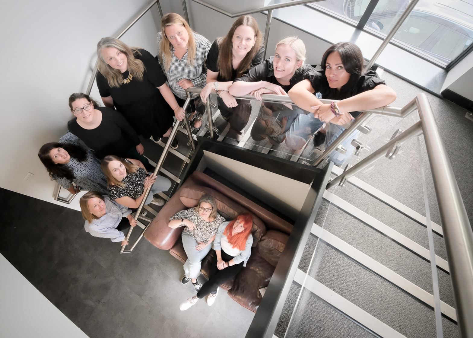 The Typeface Group team on a stair case.