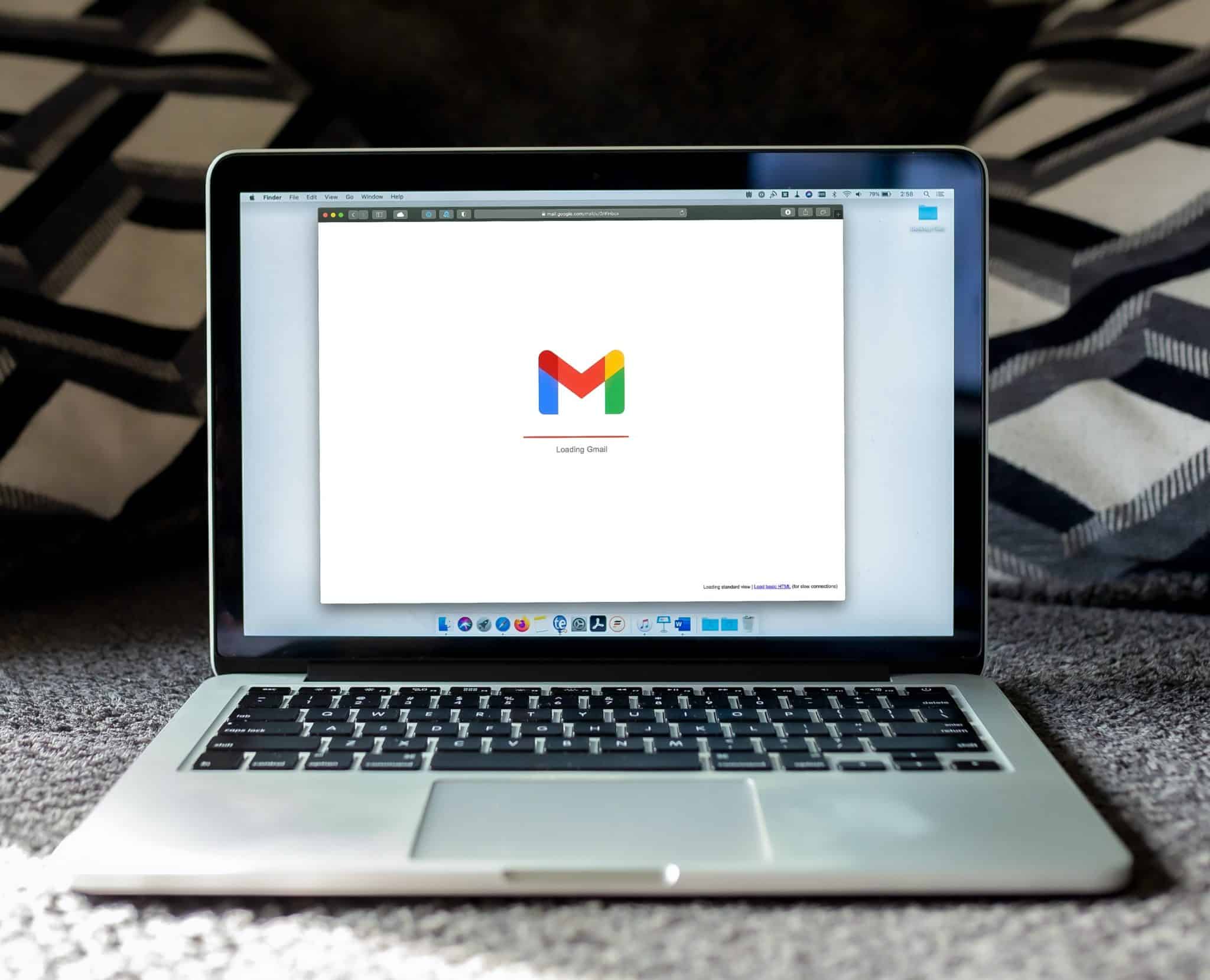 Image of a open laptop with the Gmail logo on the screen